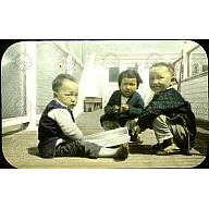 Three small Chinese children posing for the camera<br/>