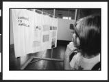 Woman of Chinese origin looking at display about coming to America, Angel Island Internment Camp, Angel Island, San Francisco, California, 2002